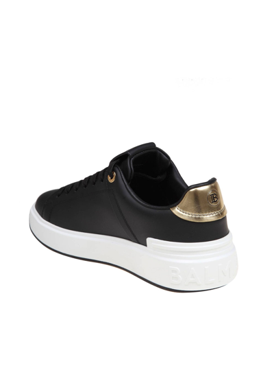 Shop Balmain B-court Sneakers In Black And Gold Leather