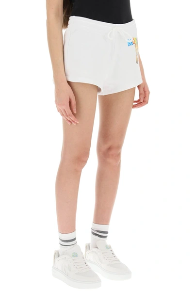 Shop Moschino Logo Printed Shorts Women In White