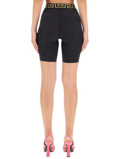 Shop Versace Cyclist Bermuda Shorts With "greek" Border In Black