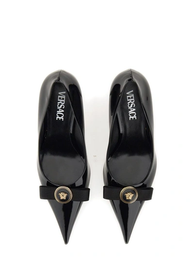 Shop Versace Gianni Ribbon Pumps In Black