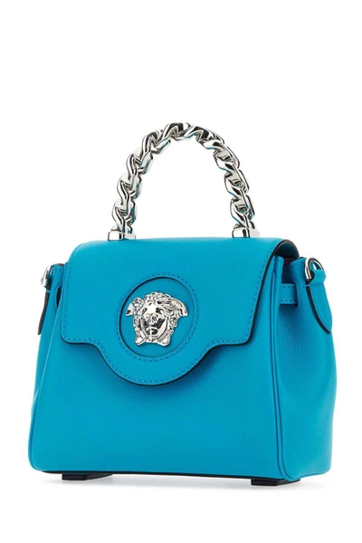 Shop Versace Handbags. In Blue