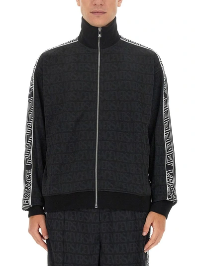 Shop Versace Zip Sweatshirt. In Black
