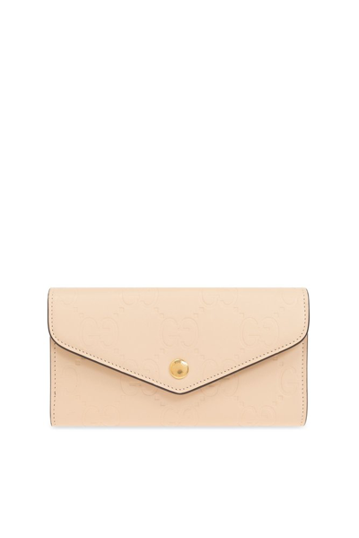 Shop Gucci Logo Embossed Envelope Wallet In Beige