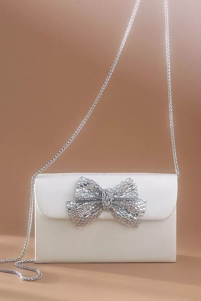 Shop Badgley Mischka Jewel  Elizabeth Satin Trapezoid Clutch With Crystal Bow In White