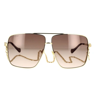 Shop Gucci Eyewear Sunglasses In Gold