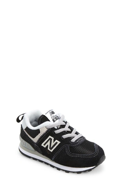 Shop New Balance Kids' 574 Sneaker In Black/ White