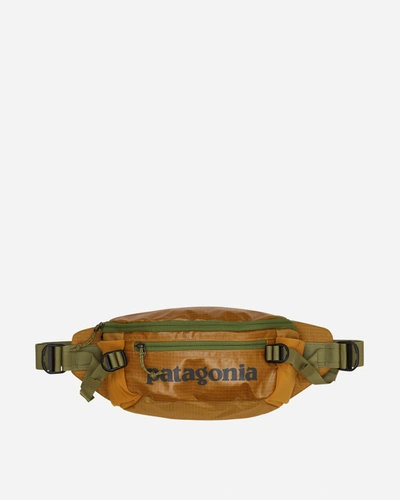 Shop Patagonia Black Hole Waist Pack 5l Pufferfish Gold In Yellow