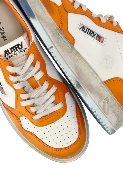 Shop Autry Vintage Sneakers In Orange