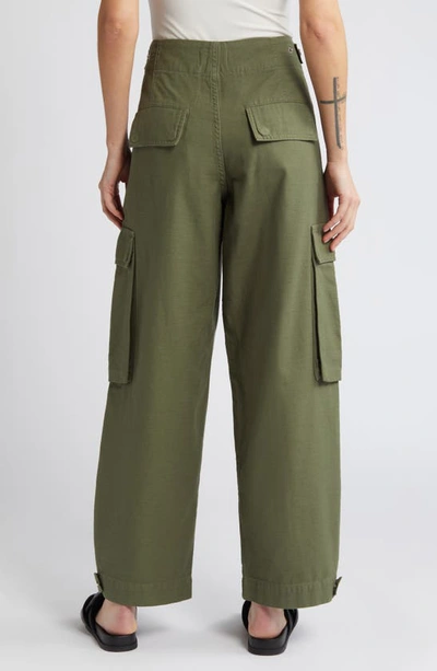 Shop Frame Wide Leg Cotton Cargo Pants In Poblano