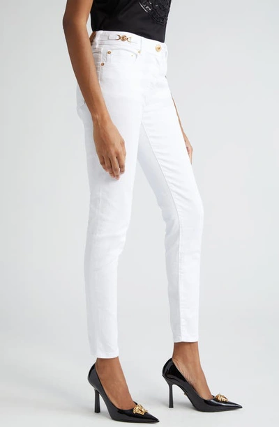 Shop Versace Medusa '95 Stretch Denim Skinny Jeans In White