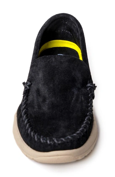 Shop Minnetonka Discover Classic Slip-on Sneaker In Black