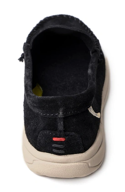 Shop Minnetonka Discover Classic Slip-on Sneaker In Black