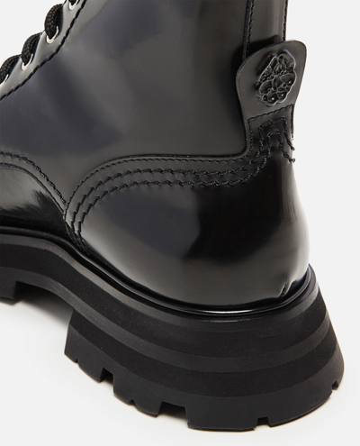 Shop Alexander Mcqueen Laced Combat Boots In Black