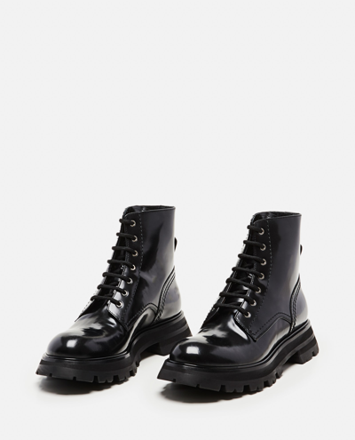 Shop Alexander Mcqueen Laced Combat Boots In Black