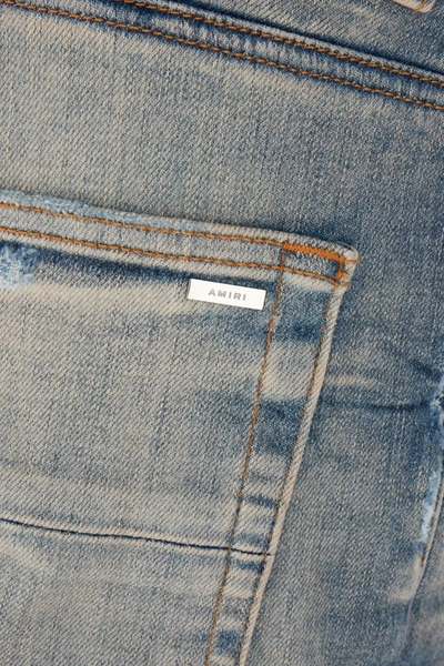Shop Amiri Distressed Jeans In Denim