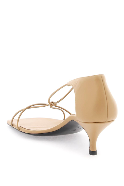 Shop Totême Leather Knot Sandals With In Beige
