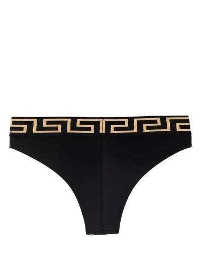 Shop Versace Slip Bikini Con Bordo Greca In Black