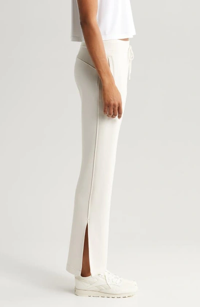 Zella Level Set Straight Leg Slit Hem Track Pants In Grey Moonbeam