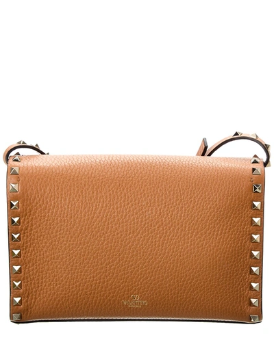 Shop Valentino Rockstud Small Grainy Leather Crossbody In Brown