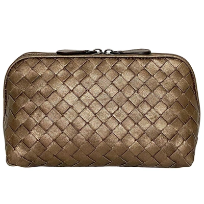 Shop Bottega Veneta Intrecciato Gold Leather Clutch Bag ()