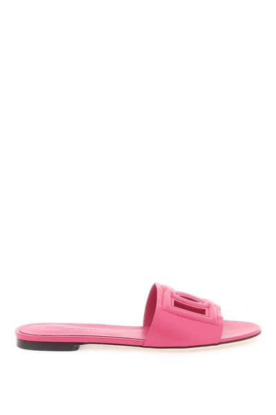 Shop Dolce & Gabbana Leather Slides With Cut Out Logo In Fuchsia