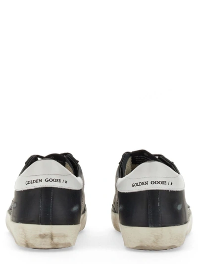 Shop Golden Goose Superstar Sneaker In Black