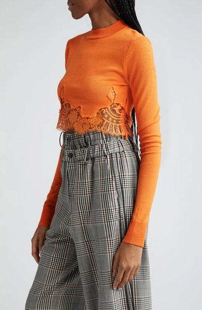 Shop Monse Lace Hem Crop Mock Neck Sweater In Orange