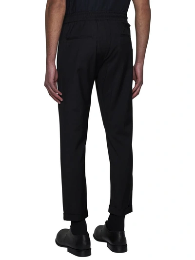 Shop Low Brand Trousers In Jet Black