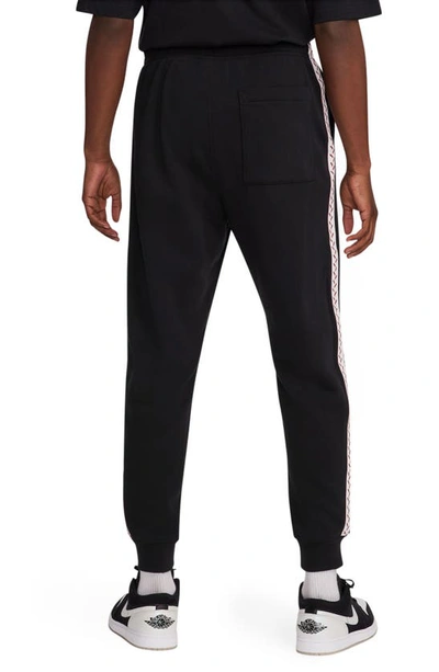 Shop Nike Jordan Cotton Blend Fleece Joggers In Black/ Dune Red