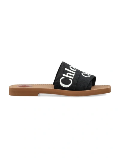 Shop Chloé Woody Slides In Black