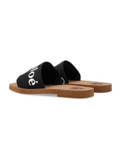 Shop Chloé Woody Slides In Black