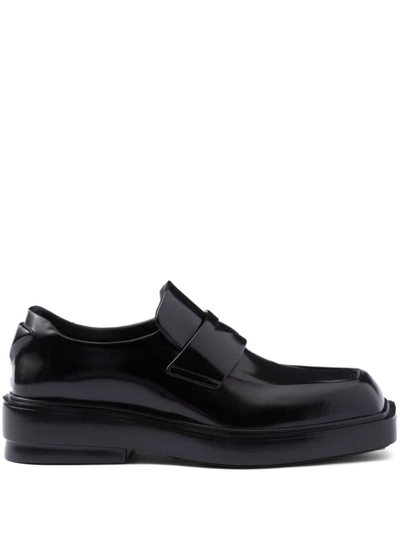 Shop Prada Triangle-patch Leather Loafers In Nero