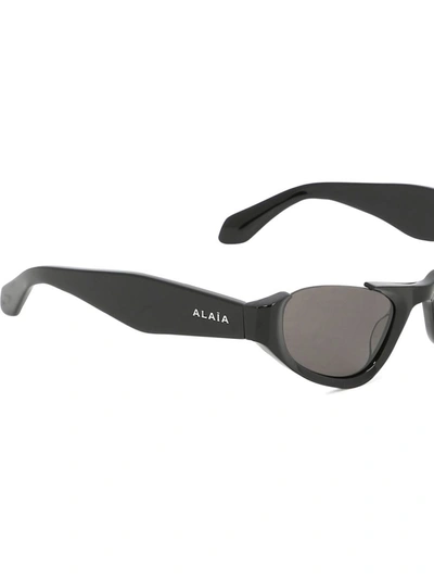 Shop Alaïa Cat-eye Sunglasses In Black