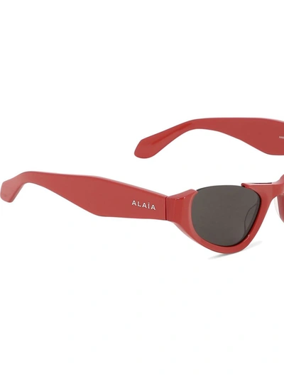 Shop Alaïa Cat-eye Sunglasses In Red