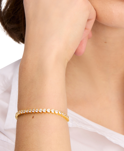 Shop Kate Spade Gold-tone Cubic Zirconia Heart Tennis Bracelet In Clear,gold