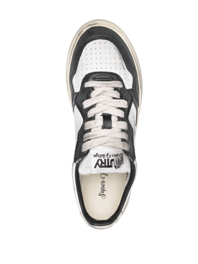 Shop Autry Super Vintage Low Leather Sneakers In Black