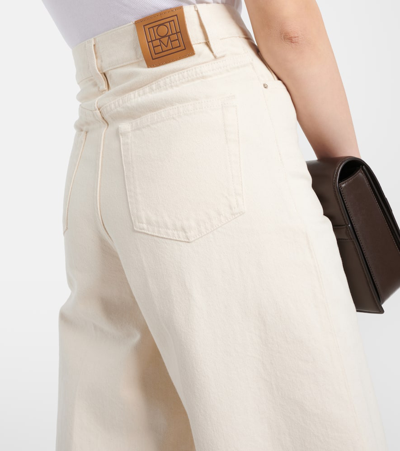 Totême Pleated High-rise Wide-leg Organic Jeans In White
