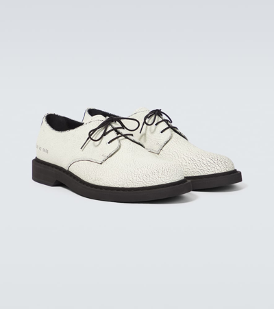 Shop Common Projects Cracked Leather Derby Shoes In White