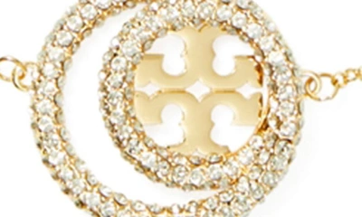 Shop Tory Burch Miller Pavé Double Ring Pendant Necklace In Tory Gold / Crystal