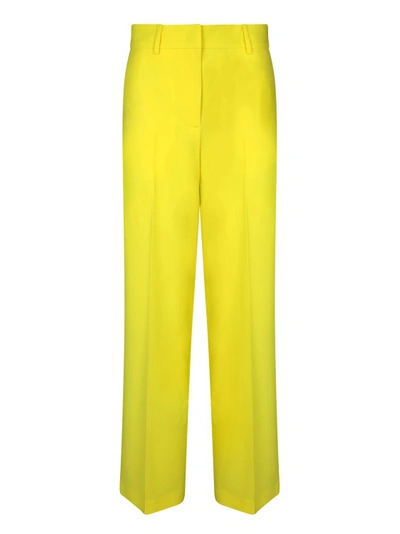 Shop Msgm Yellow Wool Trousers In Gold