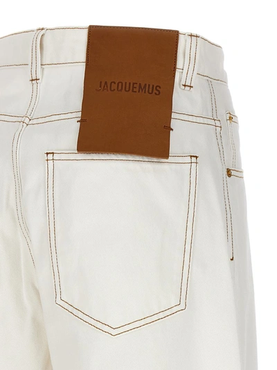 Shop Jacquemus 'le De-nîmes Large' Jeans In White