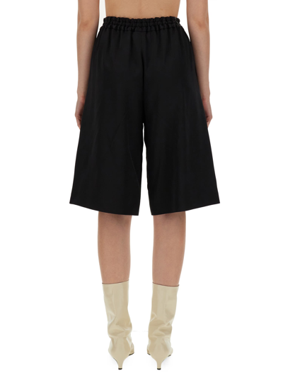 Shop Jil Sander Wide Leg Bermuda Shorts In Nero