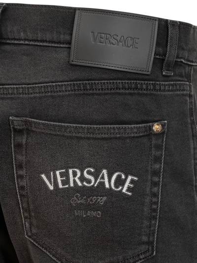 Shop Versace Medusa Jeans In Nero Lavato Sbiadito