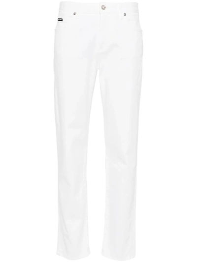 Shop Dolce & Gabbana Mid-rise Tapered Jeans In White