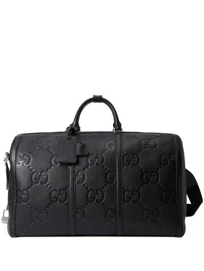 Shop Gucci Black Large Jumbo Gg Debossed Leather Duffle Bag