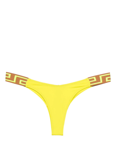 Shop Versace Slip Bikini Bordo Greca In Yellow