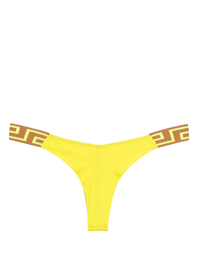 Shop Versace Slip Bikini Bordo Greca In Yellow
