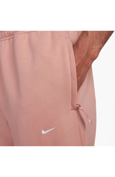 Shop Nike Solo Swoosh Fleece Sweatpants In Red Stardust/ White