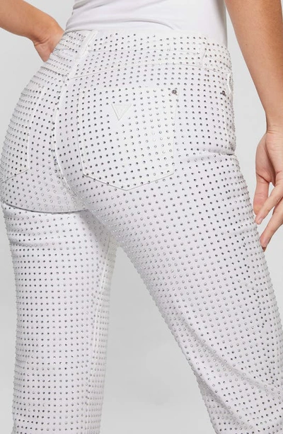 Shop Guess 1981 Embellished Straight Leg Jeans In White