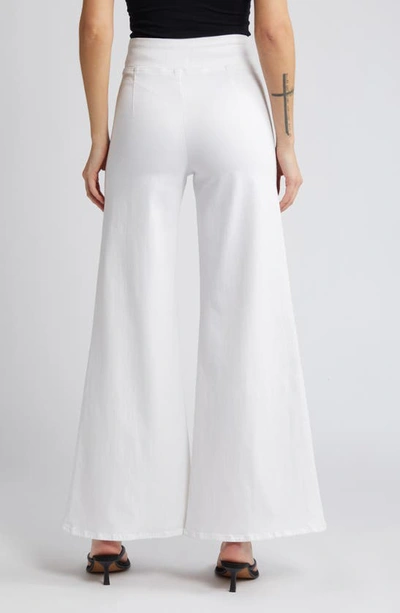 Shop Frame Jetset Wide Leg Flare Pull-on Jeans In White